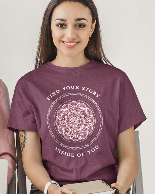Find Your Story Inside Of You Black Women's T-Shirt with an artistically designed mandala in the center with the words wrapped around it. The red mandala is a symbol of passion, high energy and strength.